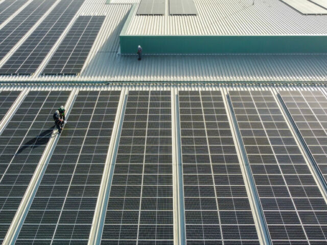 Solar,Panels,Installed,On,A,Roof,Of,A,Large,Industrial