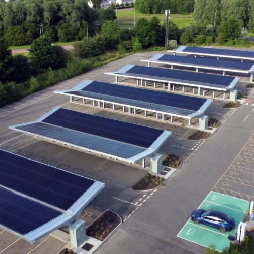 Aerial,View,Of,A,Large,Electric,Charging,Station,With,Solar